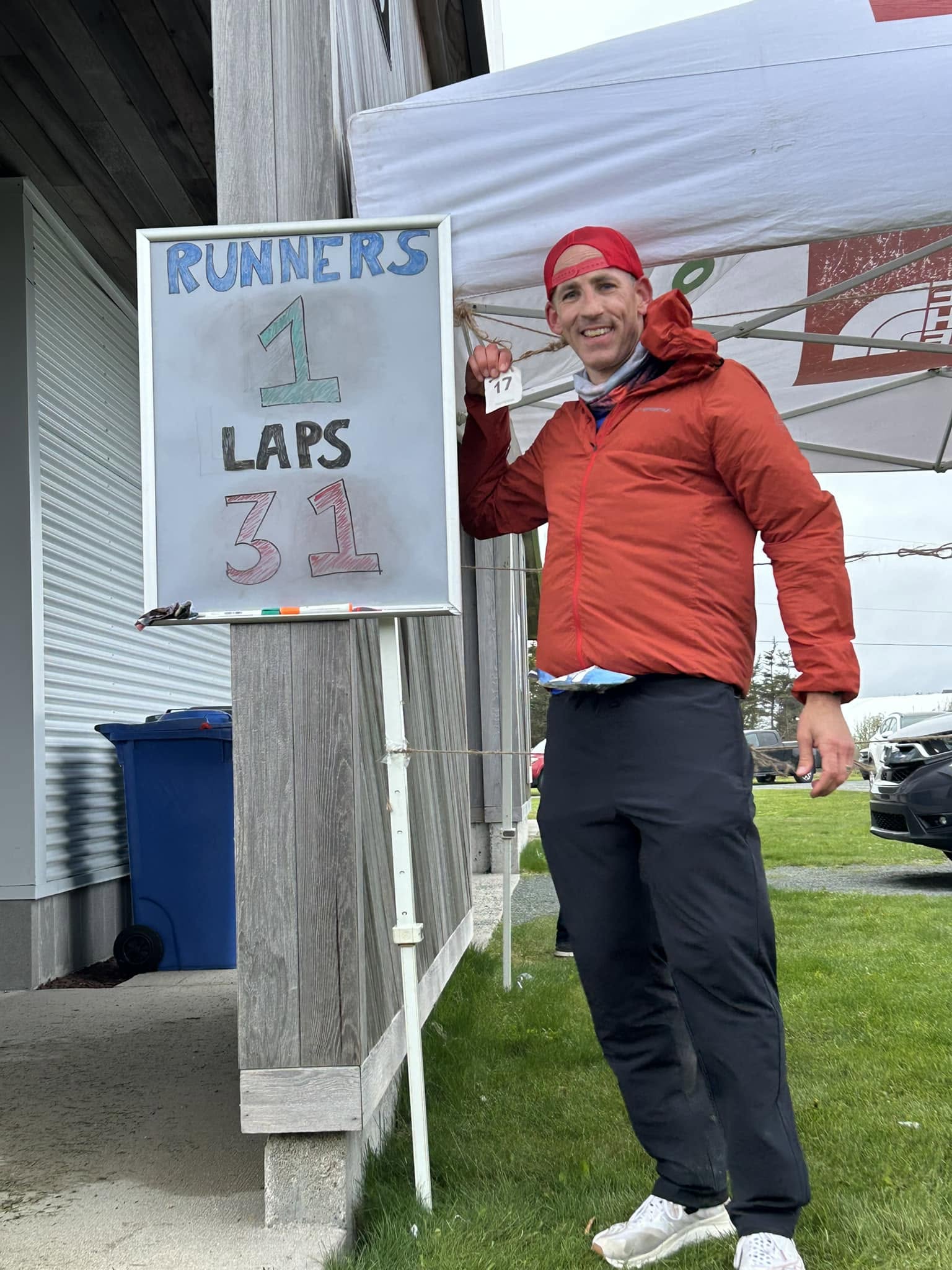 A runner celebrating after completing 31 laps