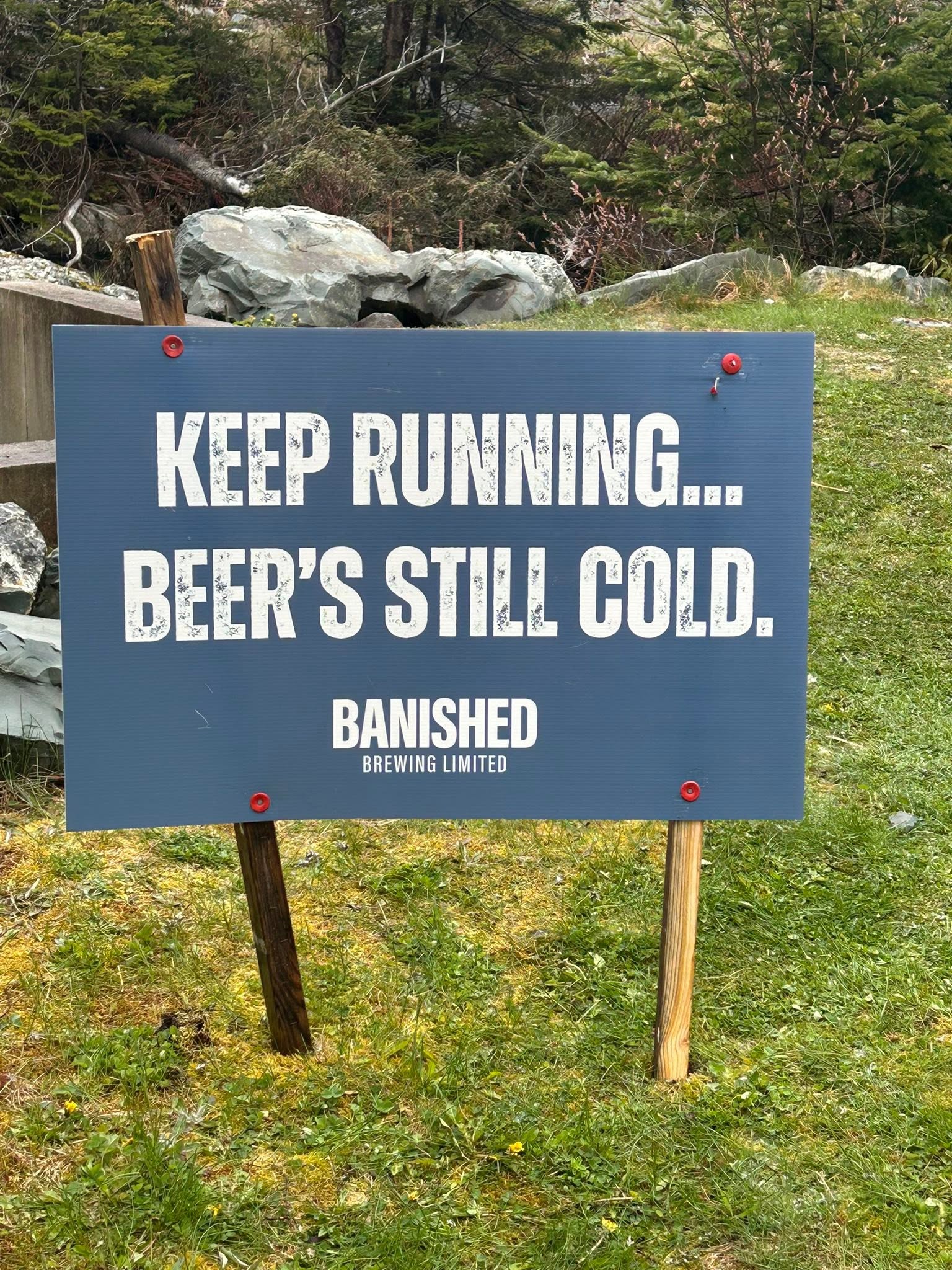 Course sign reading Keep running, beer's still cold